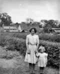 Daisy Papworth with Ann in the garden of Daisy Cottage