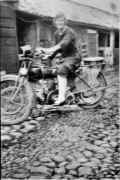 Dora Papworth on a motorcycle at the garage